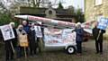 Peace Group supporters Rae Street, George Abendstern, Philip Gilligan, Linda Clair, Pat Sanchez and Trevor Hoyle with the mock missile.