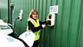 Councillor Jacqui Beswick plugs in one of the new electric vehicles