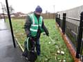 Rochdale Environmental Action Group cleaning the open area near the tram tracks on Drake Street