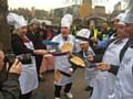 Liz McInnes flipping pancakes for charity in this year's Rehab Parliamentary Pancake Race at the Houses of Parliament