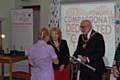 Mayoress Cecile Biant and Mayor Surinder Biant presenting an award 