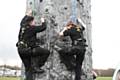 Romon Francis and Natasha Hopkins climb the 8m high mobile climbing wall - the largest in the country