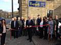 Simon Danczuk is joined by staff, residents and relatives as he cuts the ribbon to declare Riverside Nursing Home officially re-open