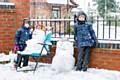 Noah and Isaac Journeaux with their snowmen