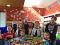 Youngsters launch the new Lego club at Balderstone Library with local councillor Richard Farnell and volunteer helper Thomas Wilcox