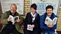 Local library staff giving out their free books