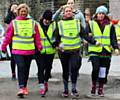 Hayley Jones, Nicholette Brady, Charlotte Maher and Becky Gibson of Littleborough Rugby Club finishing the 50 mile walk from Blackpool to Littleborough