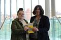 Sophie Maria Lord receiving her vouchers from Andrea Fallon, Rochdale Borough Council’s director of public health