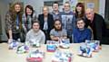 Rebecca Taylor, MacMillan end of life care administrator at Pennine Acute Trust; Joanne McAllister, volunteer service manager at Pennine Acute; Yvonne Daniels, Reece Kenworthy, Sam Perrin, Kirsty Crawford, support worker and Gary Baynham, key worker.  Front row, left  to right: Mollie Fennelly, Usman Khan and Daniel Taylor