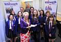 Retiring Mayor of Whitworth Councillor Lynda Barnes presents Ambassador Katie Bray with a cheque for £200 to help towards training with other ambassadors and Assistant Headteacher Paul Dugdale