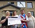 Andrew Nutter presents the cheque for £4,000 to Melanie Caffrey from Springhill Hospice together with Hannah Powell, landlady of The Bird At Birtle, and Louise Scott from H Bell & Sons