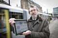 TfGM Committee Chairman Councillor Andrew Fender using the free wi-fi