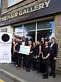 Kelly Earnshaw of The Hair Gallery and Asif Ali, The Clothing End raise over £1800 for Springhill Hospice