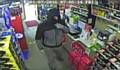 Still from CCTV footage of armed robbery at Bargain Booze, Littleborough