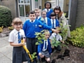 St Andrew’s Primary School Eco-Team planting four saplings with Councillor Rina Paolucci