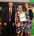 NSPCC Rochdale Branch Chair, Merilyn Chadwick, being presented with the Branch of the Year award by Royal Patron of ChildLine and NSPCC President, HRH The Countess of Wessex, alongside NSPCC Chief Executive Peter Wanless