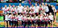 Great Britain's hockey players and staff on the podium with their gold medals