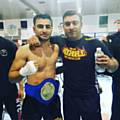 Adil Hussain crowned the AFK-1 British Champion with Shazad Hussain, Head coach of Rochdale Thai Boxing Club