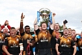 Rochdale Hornets celebrate a magnificent victory over Toulouse Olympique in the League One Promotion Final at Stade Ernest-Argelés in Blagnac, France