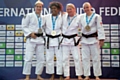 Sophie Cox (left) on the podium with her silver medal