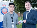 Changyu Yang, a GMP apprentice, with Councillor Sean Anstee