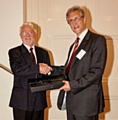 Professor Nikola Stosic (left) recognises the considerable contributions made by Dr. Christopher Holmes (right), to the International Conference on Compressors and their Systems