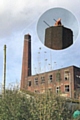 Work to reduce the height of a chimney at the former Dexine Rubber Mill in Spotland has begun.