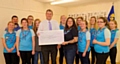 Councillor Chris Furlong presents the final cheque to Heywood Guides Senior Section from his charity runs earlier this year