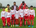 Brian Nyoni with Abdul Hye and the Shawclough FC U10s team