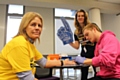 Councillor Jacqueline Beswick being tested by Emma Zurowski (Black Health Agency) and Craig Langton (Lesbian, Gay, Bisexual and Trans Foundation)