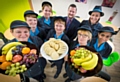 The catering team at Lowerplace Primary School in Rochdale celebrate with Headteacher Garry Johnson. (Left to right: Ellen Golden, Theresa Buckley, Lisa Hill, Marion Roberts, Garry Johnson, Christine Lancelott, Claire Carroll and Saika Ilyas)