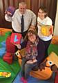 Richard Farnell and Kathleen Nickson try out the new soft play area with Rev Angela Bryan