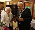 Mayor Ray Dutton presents Gladys Liddell with a special certificate to celebrate her 100th birthday