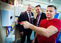 Councillor Richard Farnell, leader of Rochdale Borough Council with Paul Quinn, managing director of Greenage Utilities, and trainee Dean Jones