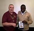 Middleton Rotary Club President Ged Heatherington with Father Eliud 