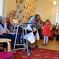 Children sing incy wincy spider for residents at Half Acre House 