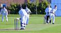 Young Thornham bowler R Baxter attempts to dislodge the Westhoughton middle order