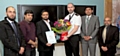 Superintendent John Ruffle was presented with a floral bouquet by members of the Pakistani and Kashmiri Community Association