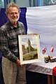 Tony Smart with his painting featuring the new bridge over the River Roch in the town centre