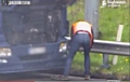 Lorry driver discards oil container by motorway