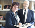 Councillor Janet Emsley and Dianu Sfrijan, with a book of memories of Sheila Sfrijan