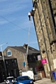 The man was snapped on the ladder balanced on the transit van in Whitworth