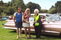 Rochdale Rotary President Ann Stott presenting the Jaguar Car wheel trim trophy to owners of  best car in show