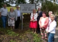 Alan Rawsterne, Cecile and Surinder Biant, The Mayor and Mayoress, Ian and Christine Duckworth, Janet Emsley, Tony Lloyd MP and Sue Devaney at the new Catley Lane Head sign