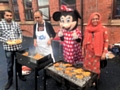 Councillor Sameena Zaheer and Minnie Mouse in charge of the barbecue at the family fun day