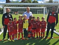 Dave Mercer (centre) from the Mercer Group, Malc Grimwood (left) and Des Mandivenga (right) with Shawclough FC U7s