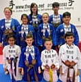 Dojo members with their world medals