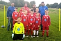 The team show off their new kits with their sponsors, and manager, Andy Green