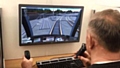 BBC Radio Manchester DJ Mike Sweeney attempting the tram driving simulator at the Metrolink Silver Jubilee event earlier this year