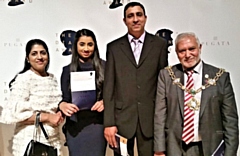 Sarah Mahmood with her parents and the Mayor of Rochdale